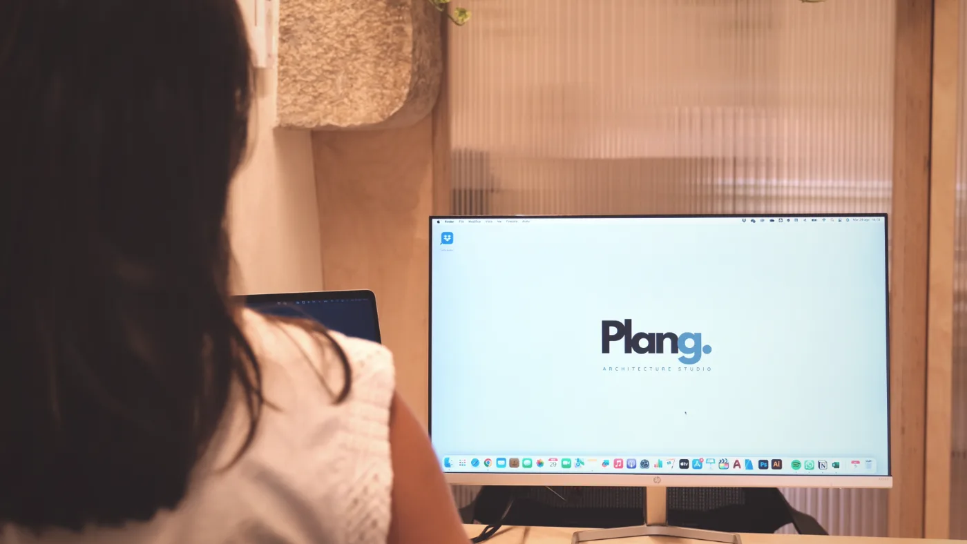 An architect at her desk in the Plang studio in Verona, working on a project